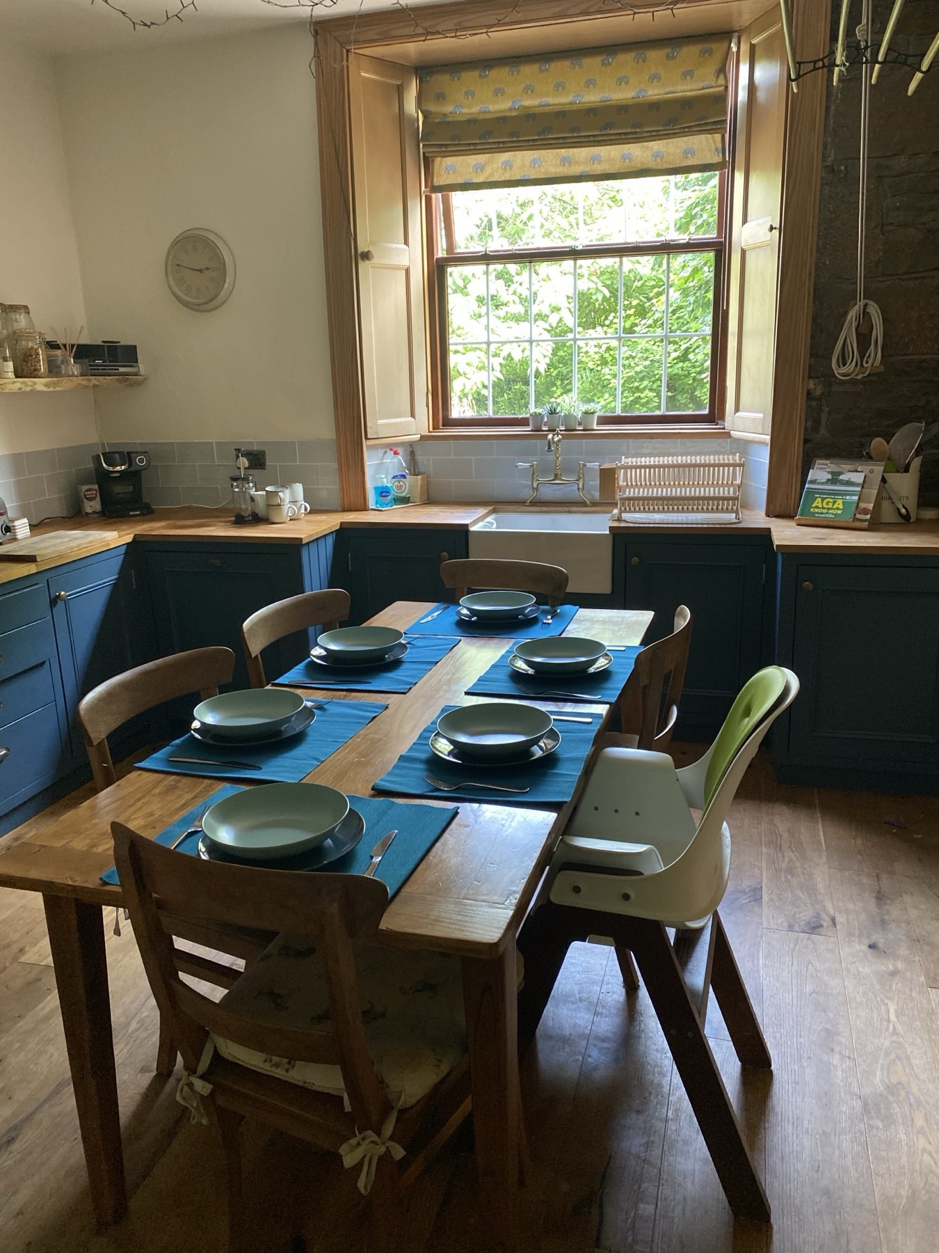 Solid wood throughout — table, worktops, floors